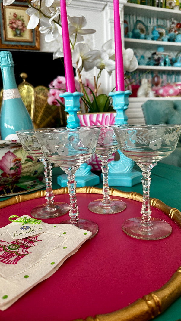 Vintage Champagne Coupes by Libby Sharp styled on a hot pink tray with cocktail napkins and champagne