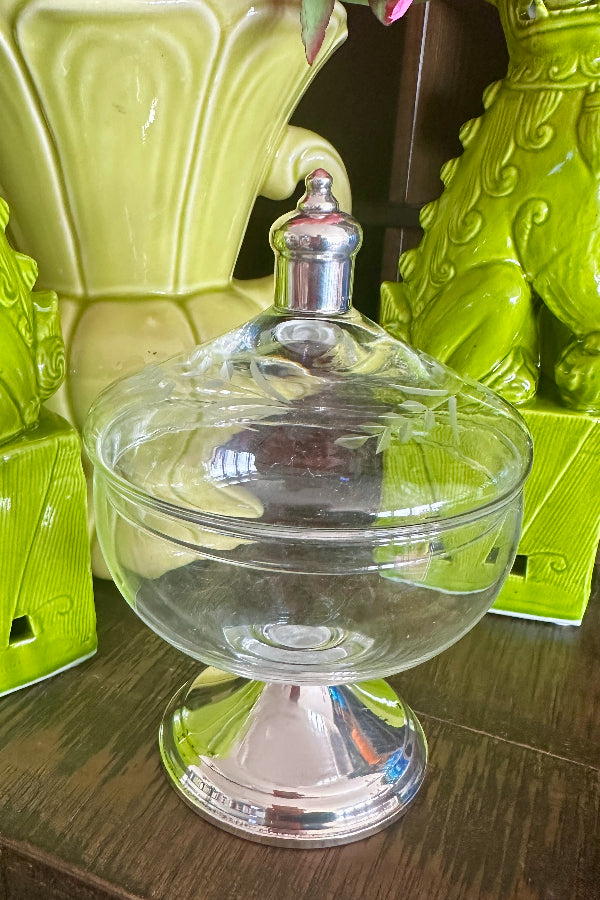 Vintage Duchin Candy Dish with etched glass flowers and sterling silver base and top styled on a table