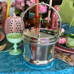 Vintage Silverplate Ice Bucket with a n engraved coat of arms  styled onn a dining tablescape